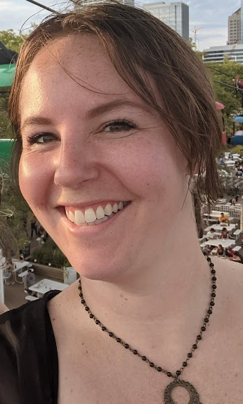 Amy, the author, smiling at Summerfest